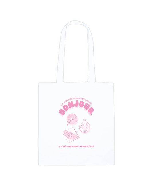 Sac à anse de la collection Bonjour Petit Déjeuner. Tote-bag blanc avec impression rose dessus.